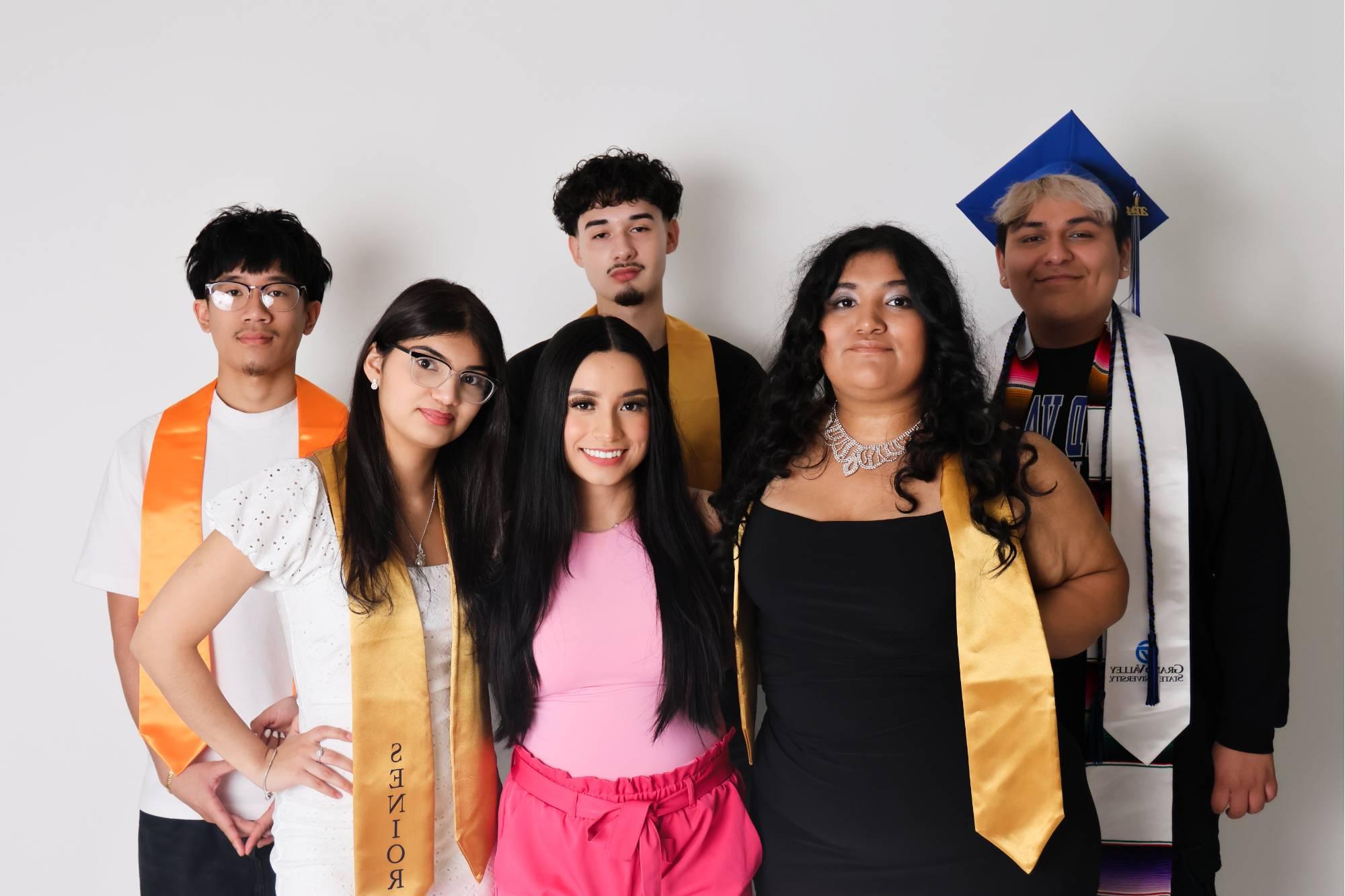 students with graduation gear